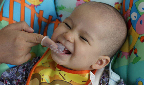 Cleaning Milk Teeth with Brush